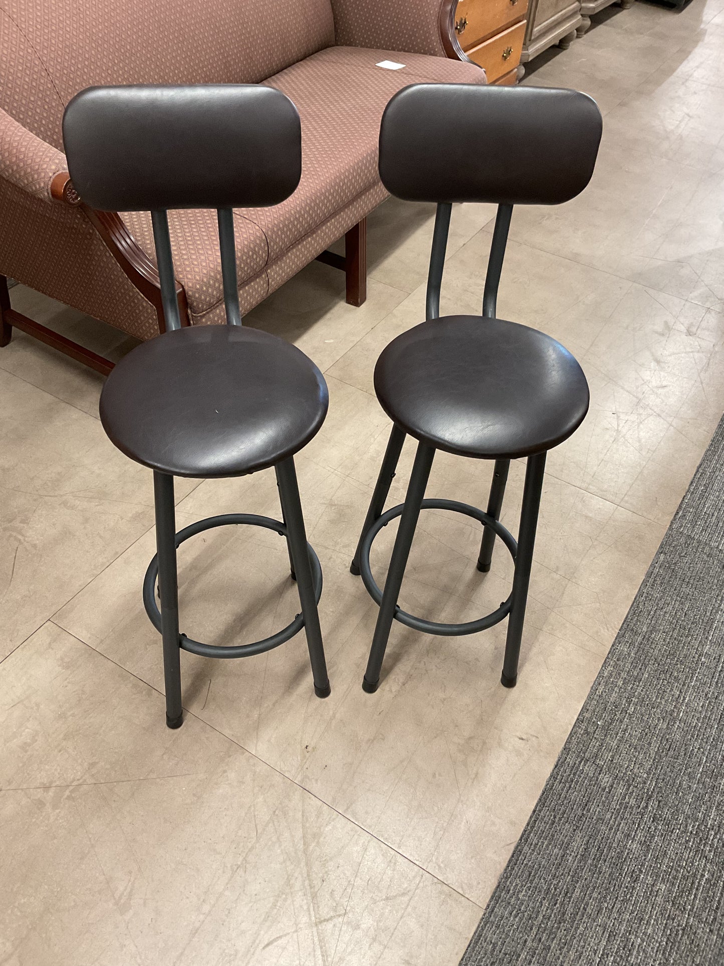 Pair of dark bar stools with backs
