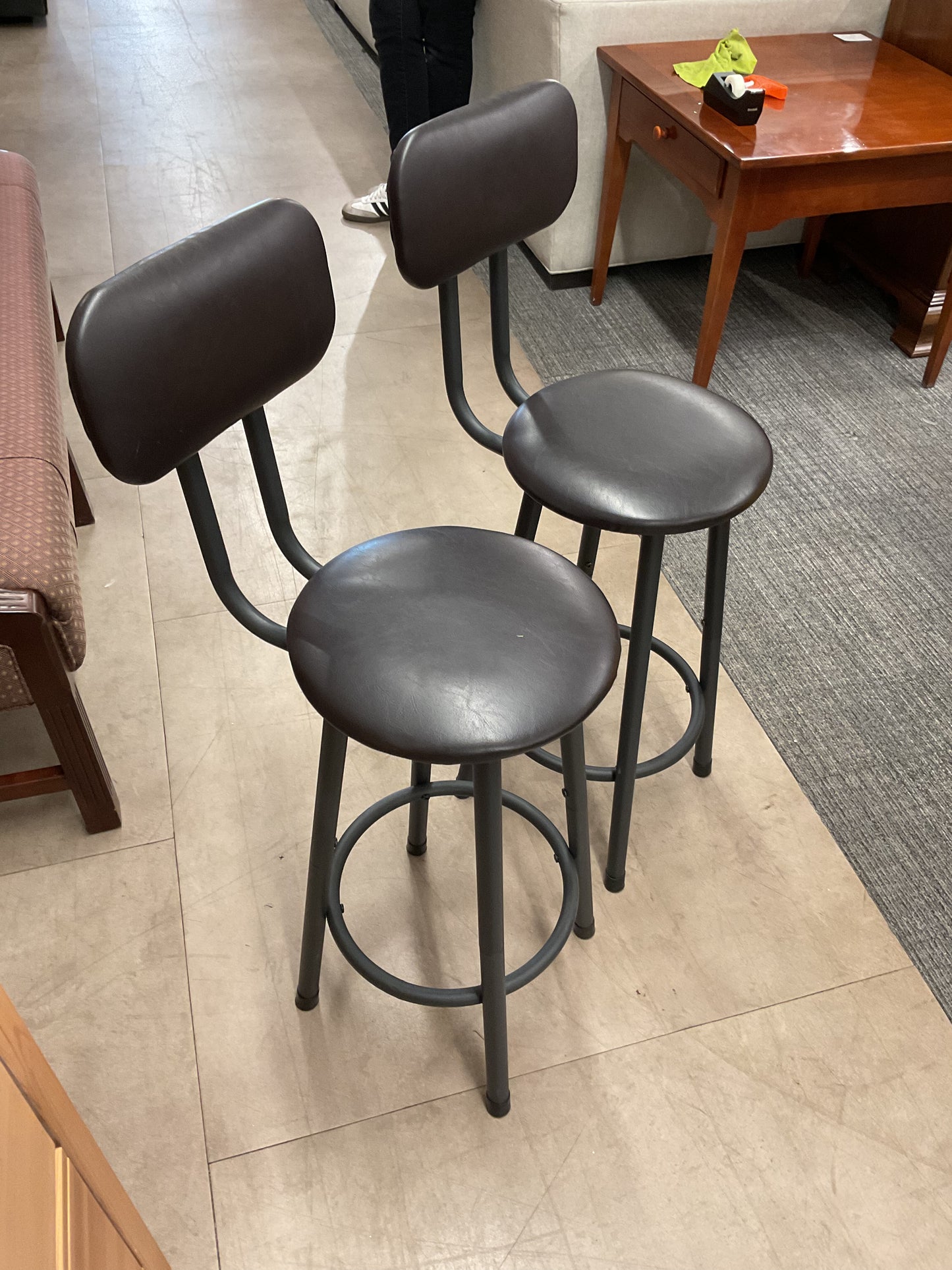 Pair of dark bar stools with backs