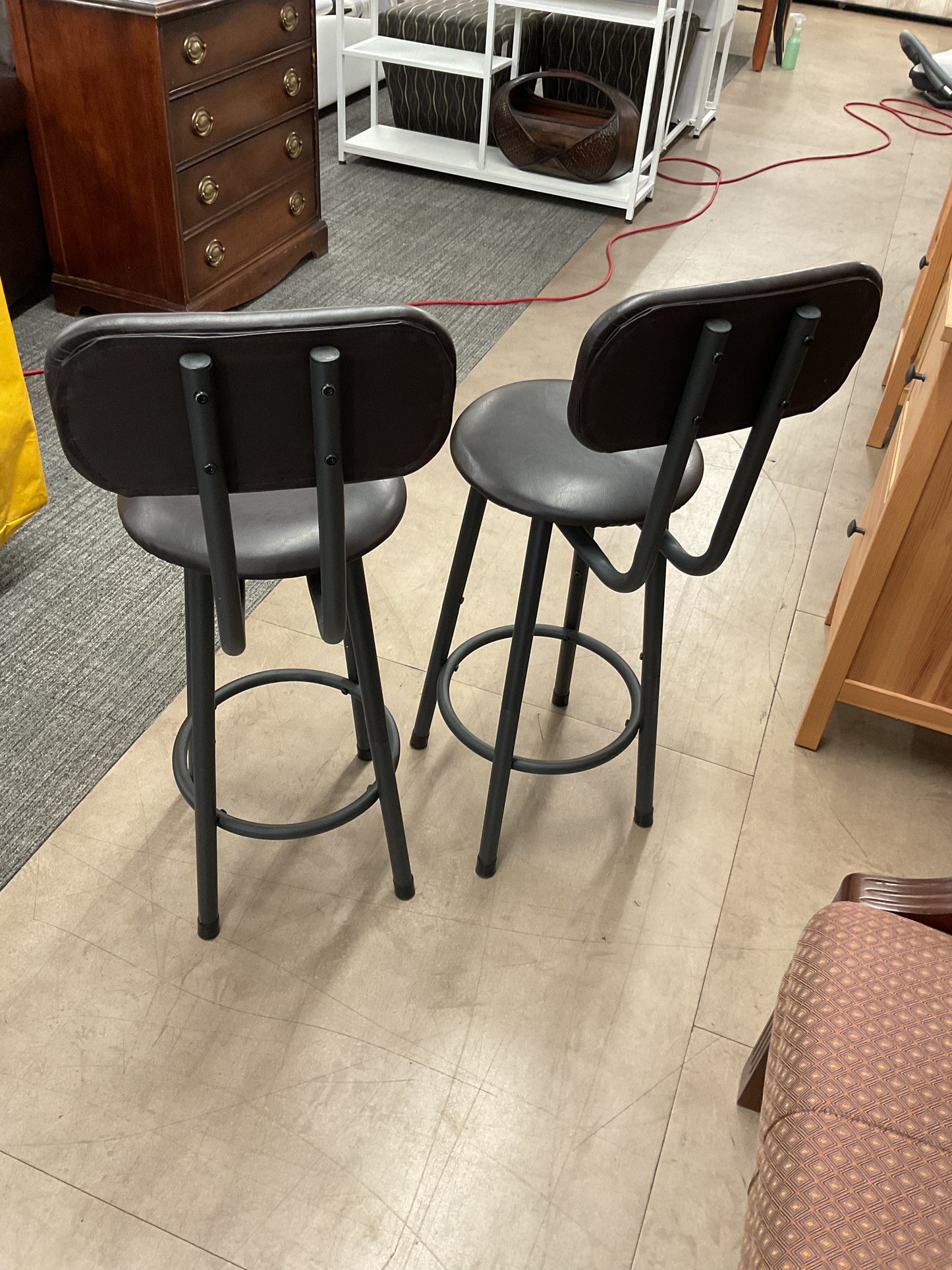 Pair of dark bar stools with backs